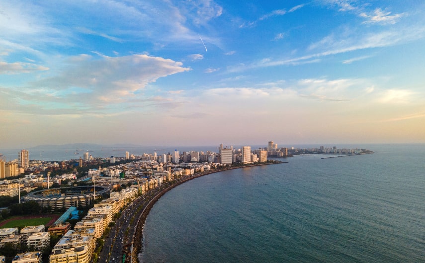 Take a drive along the coast at Marine Drive in Mumbai.